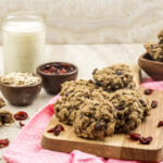 Delicious cranberry oatmeal cookie in a wooden board