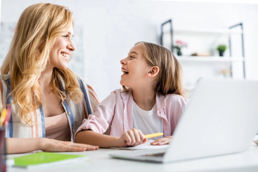 mom and daughter working on schoolwork