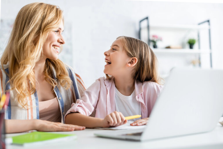 mom and daughter working on schoolwork