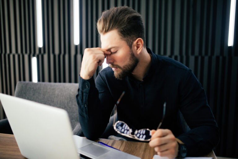 man at desk stressed ou