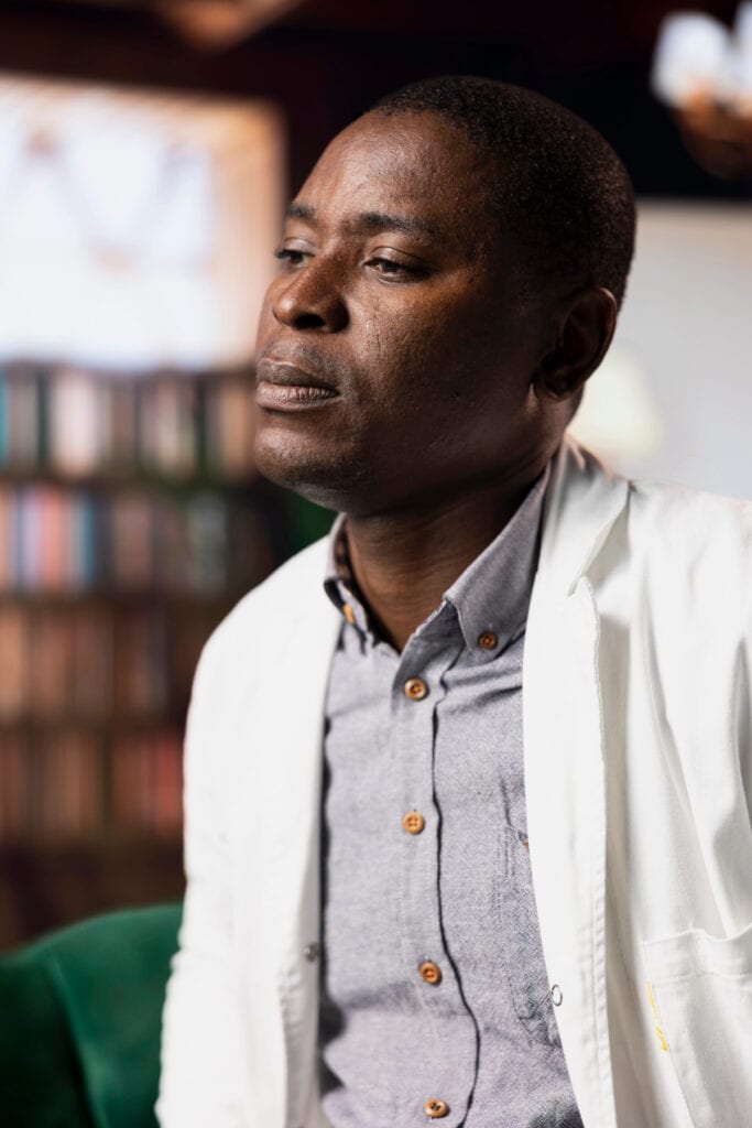 man sitting with eyes closed