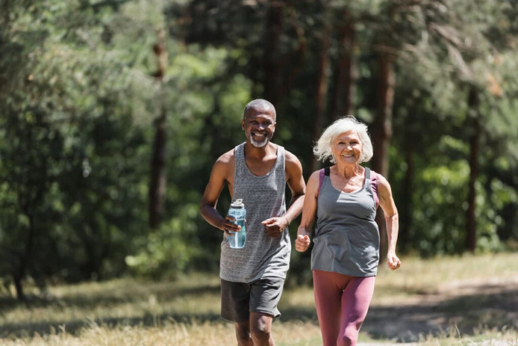 two adults walking outside for exercise