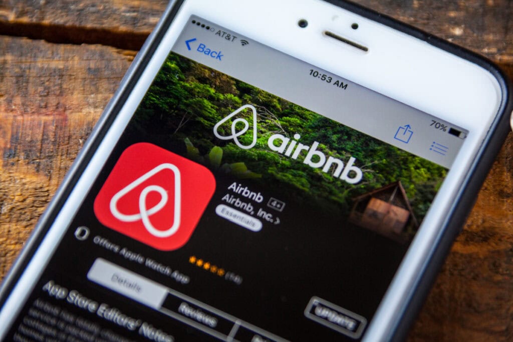 phone with airbnb app on screen