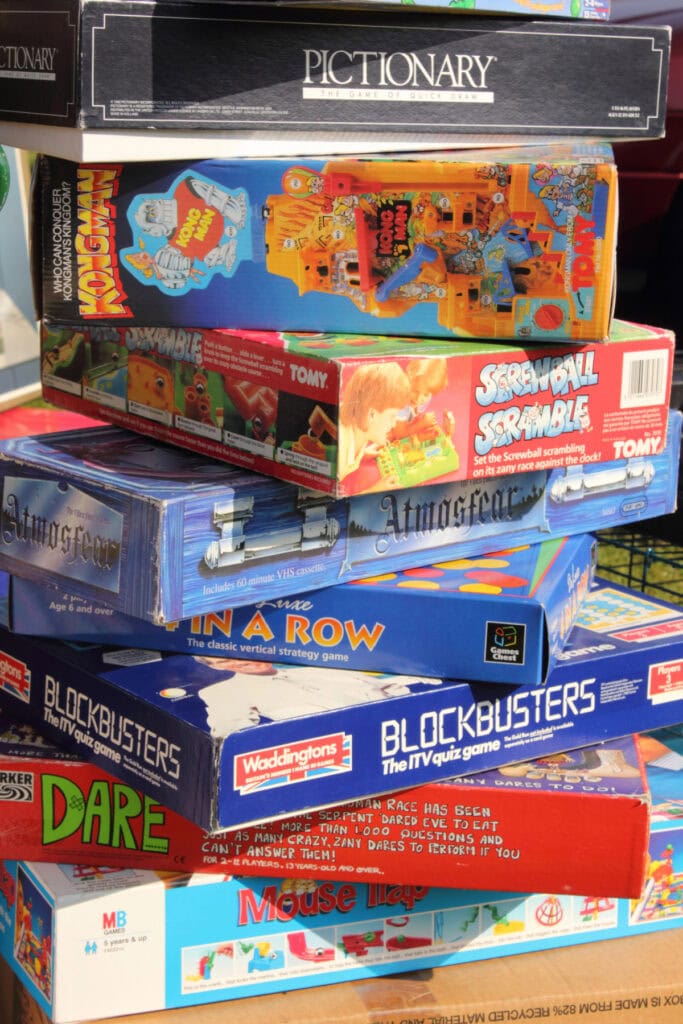 stack of board games in boxes