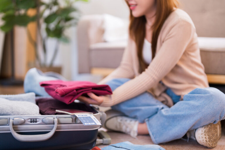 woman packing a suitcase