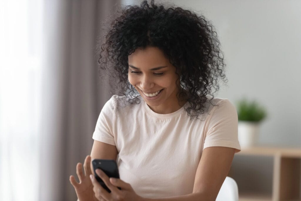 woman playing games on her phone