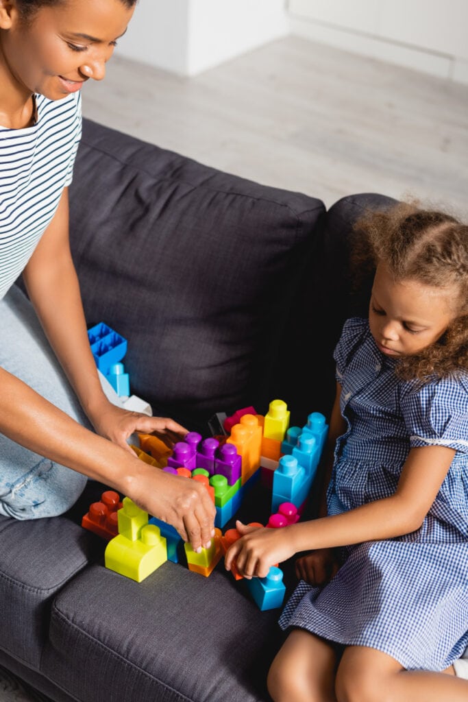 au pair playing with a child