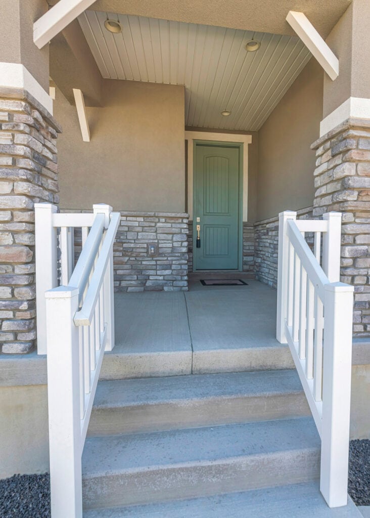 front porch with handrails on both sides