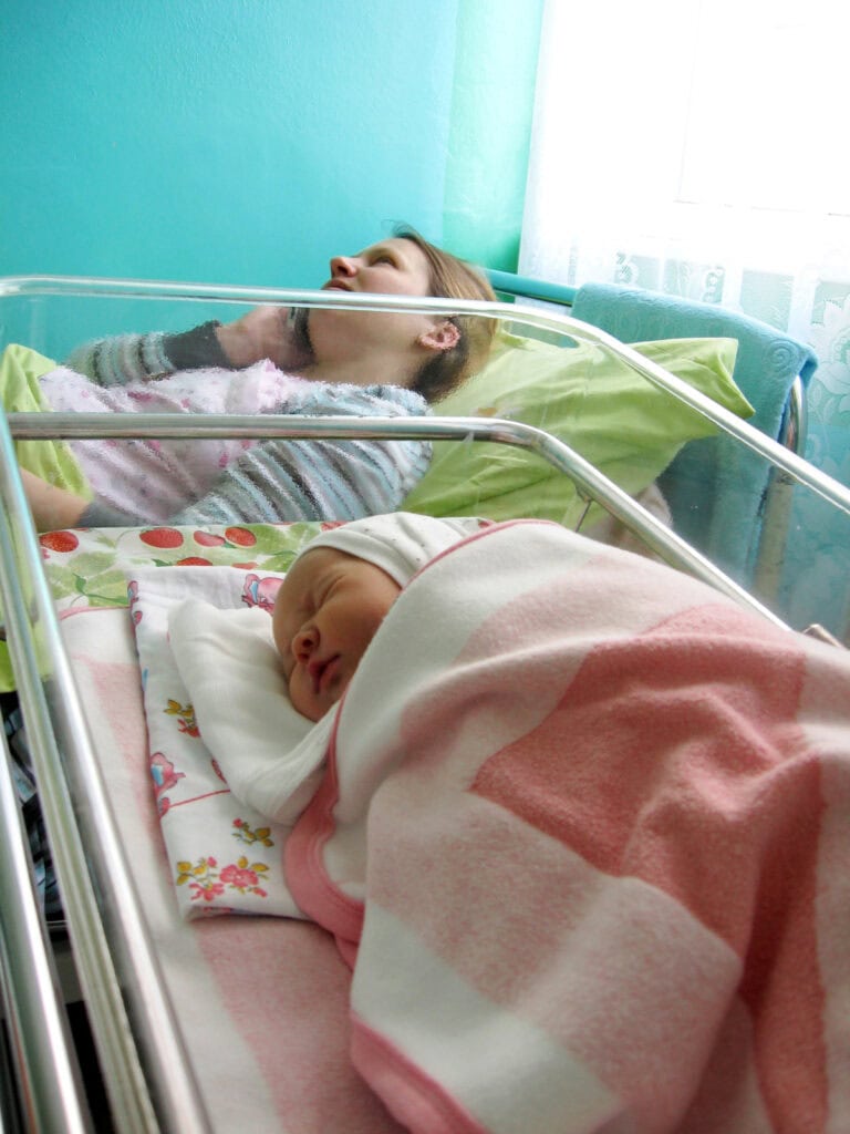 new baby asleep in crib