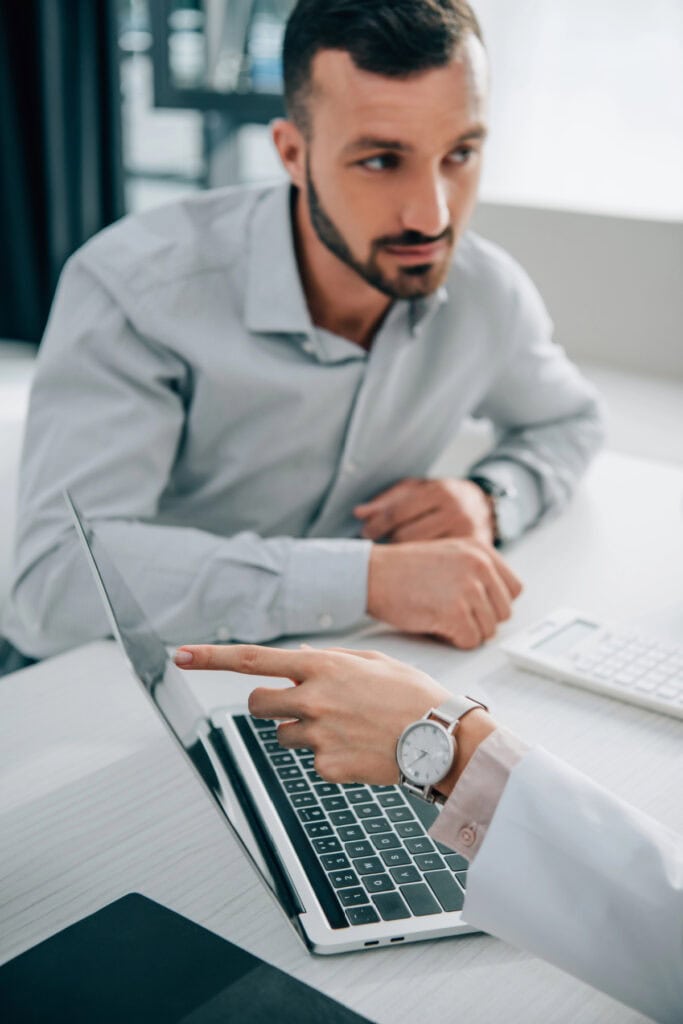 man looking at a computer