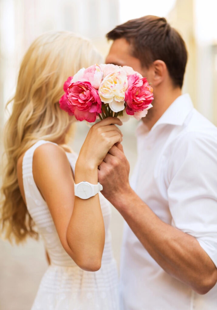 man and woman getting engaged