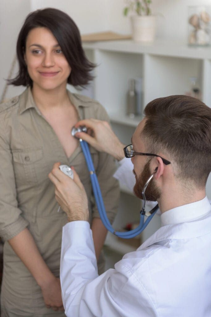 woman getting a health check up