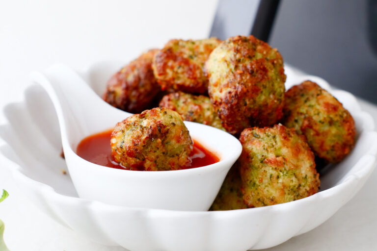 close up view of dipped broccoli tater tot