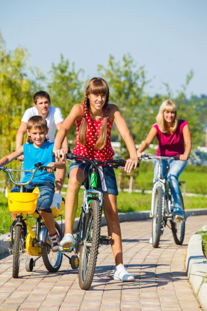 family cycling with kids
